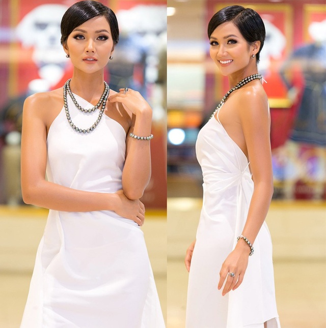 H'hen Niê, Hoàng Thuỳ, mặc đẹp nhất tuần; Elly Trần "hoá" thảm hoạ thời trang - 2 Tân Hoa hậu Hoàn vũ chọn sắc trắng trong bộ đầm cổ yếm khoe vai trần quyến rũ. Cách trang điểm nhẹ nhàng, tinh tế kết hợp cùng ngọc trai đen sang trọng khiến cô vô cùng nổi bật.