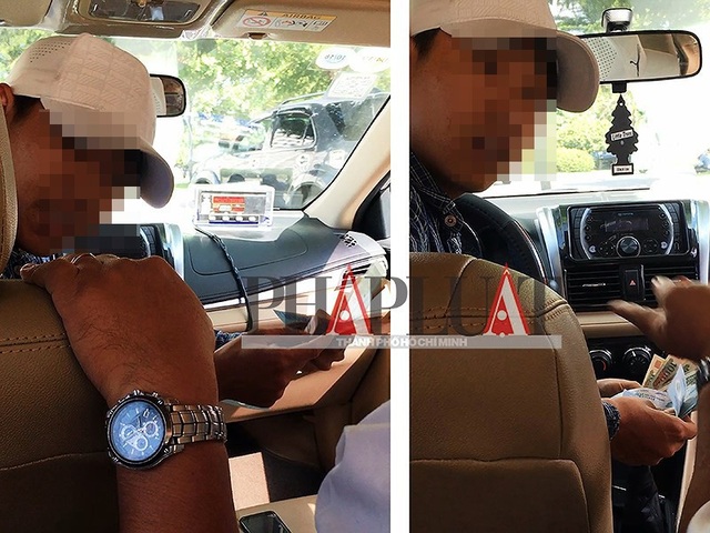Tài xế taxi dù 51G-503.52 đánh tráo tờ 500.000 đồng của khách nhưng miệng luôn la lớn “You Alibaba!”. (Ảnh cắt từ clip)