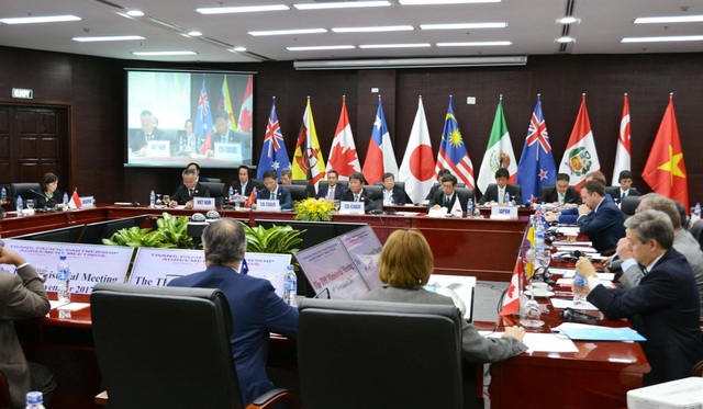 Hậu Brexit, Anh bất ngờ "đánh tiếng" muốn gia nhập TPP - 1 Các bộ trưởng từ 11 nước thành viên thông qua việc đổi tên TPP thành CPTPP tháng 11/2017 tại Việt Nam. (Ảnh: Kyodo)