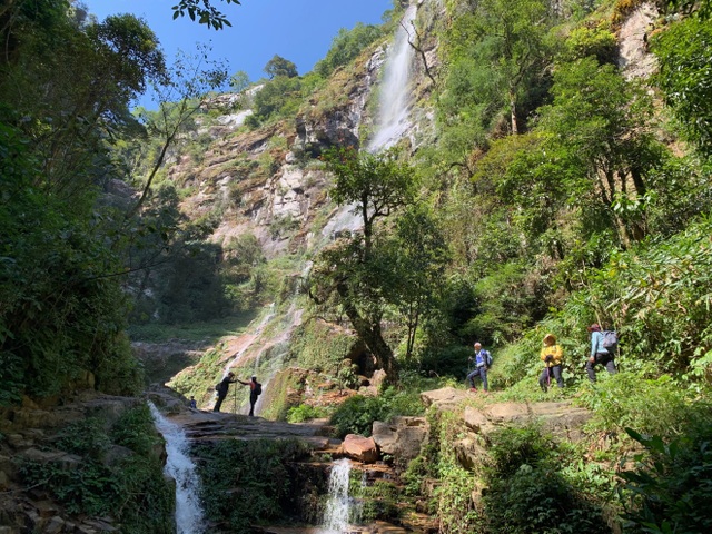 Beautiful scene holding people's feet on Nhiu Co San climbing bow and ancient stone road Pavie - 3