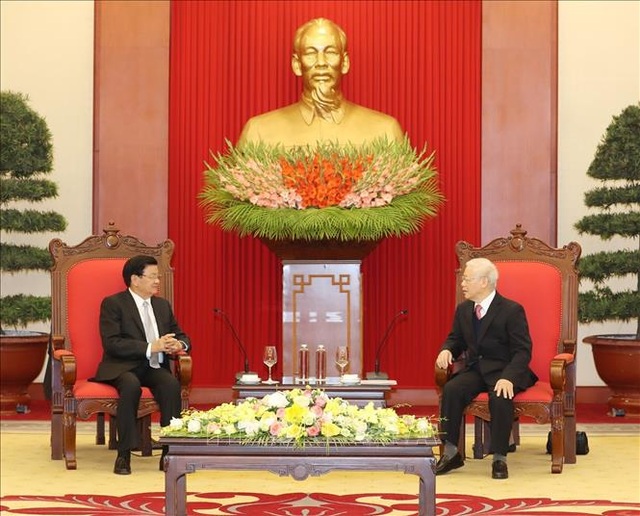 Secretary General and President of State Nguyen Phu Trong welcomes Laos Prime Minister - 1