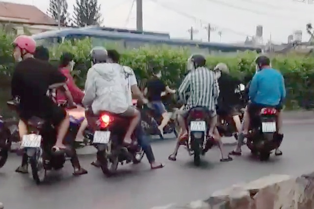 Tạm giữ 11 thanh thiếu niên trong nhóm quái xế chặn quốc lộ đua xe - 1