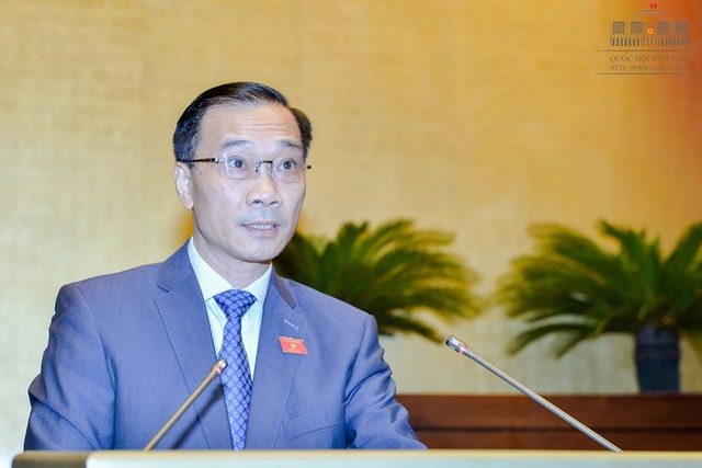 Trình Quốc hội đưa đấu giá nợ xấu vào luật - 1 Ông Vũ Hồng Thanh, Chủ nhiệm Ủy ban Kinh tế của Quốc hội trình bày Báo cáo giải trình, tiếp thu, chỉnh lý dự án Luật đấu giá tài sản (Ảnh: Quochoi.vn)