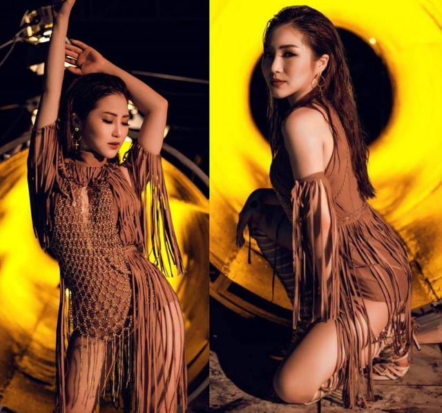 Hương Tràm, Lý Nhã Kỳ mặc đẹp nhất tuần; Á hậu Tú Anh lọt top sao mặc xấu - 1 Hương Tràm nóng bỏng đến bất ngờ trong sản phẩm âm nhạc vừa ra mắt, hứa hẹn một hình ảnh mới trưởng thành, cá tính hơn trong thời gian tới. Giọng ca gốc Nghệ An diện jumpsuit tua rua, đan lưới lạ mắt, kết hợp với layout make up tông nâu cam trông rất “Tây”.