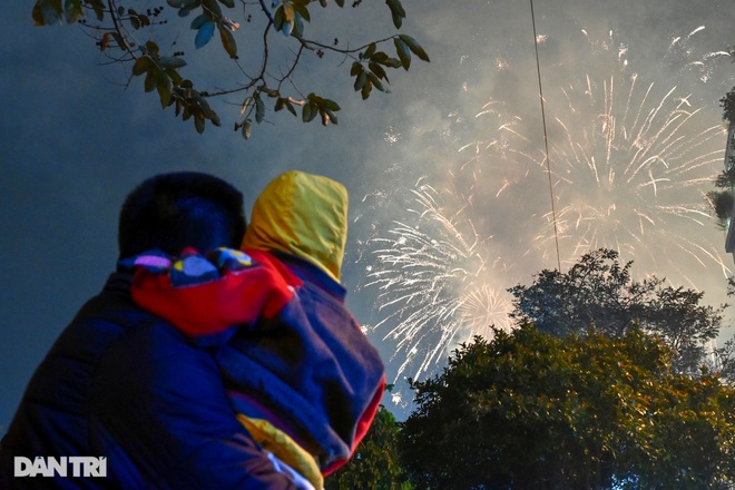 Watching fireworks at the night of 30th Tet - a quiet New Year's Eve minute in Hanoi - 11