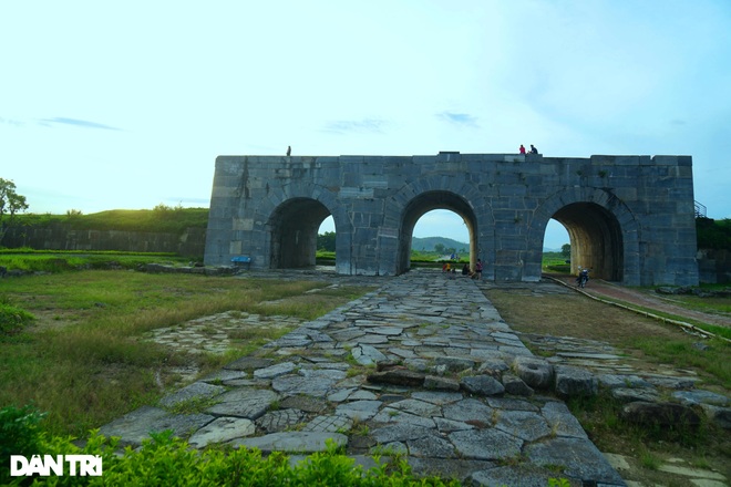 A glimpse of the sunset next to the unique stone work - 1