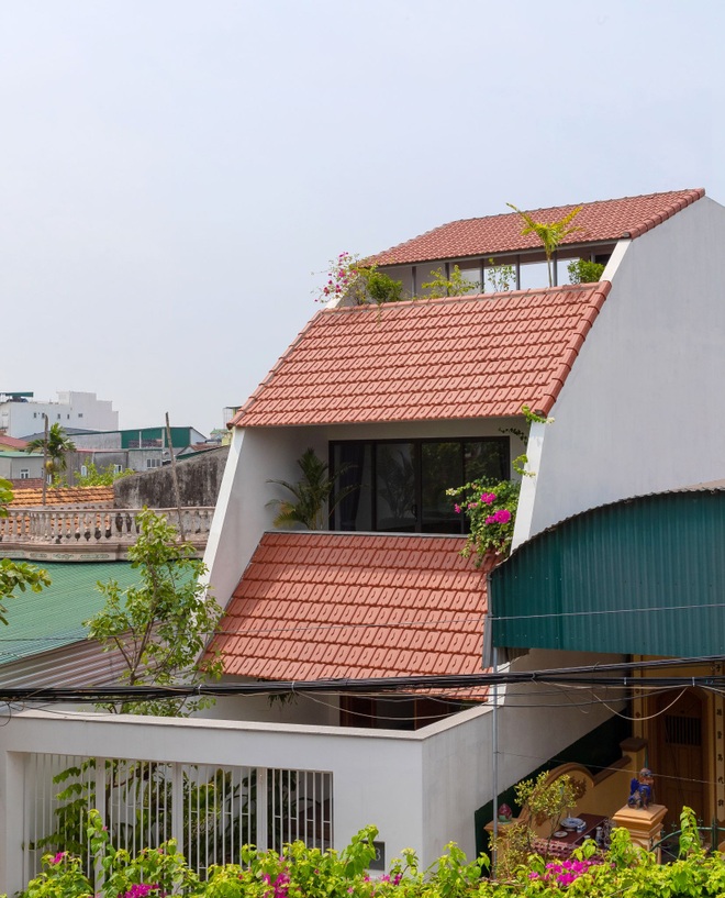 Nhà mái trượt tạo không gian sống xanh, giữ ký ức của gia chủ Nghệ An - 2 Nhà mái trượt tạo không gian sống xanh, giữ ký ức của gia chủ Nghệ An - 2