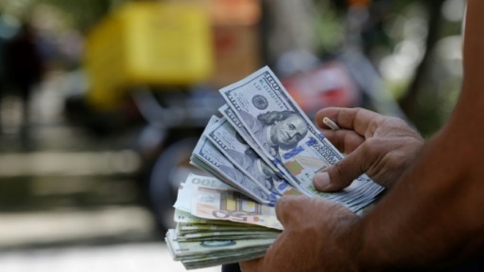 Iran suspends nuclear deal curbs in push for relief from US sanctions - 1