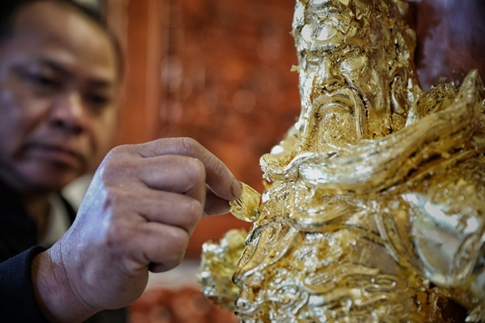 Gold laminating and gilding in Kiêu Kỵ Village recognised as natural heritage - 1 Gold laminating and gilding in Kiêu Kỵ Village recognised as natural heritage - 1