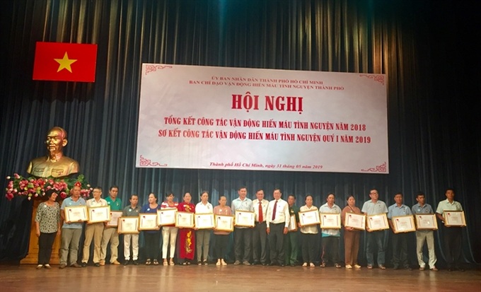 Outstanding blood donors honoured in HCM City - 1