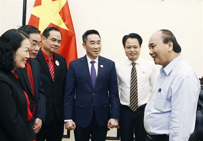 President asks Red Cross society to help the poor enjoy Lunar New Year - 1