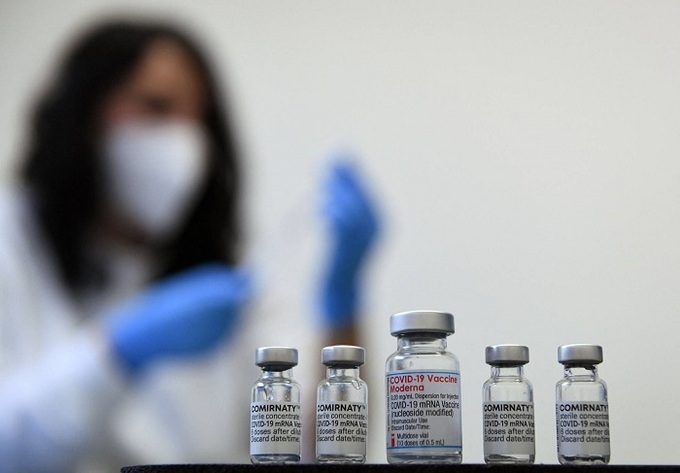 Officials offer vaccine reassurance; WHO advises against travel bans - 1