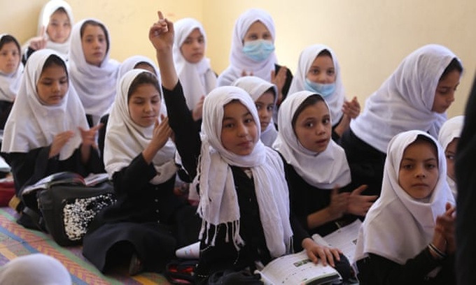 Thousands of Afghan girls return to school as Taliban end ban - 1