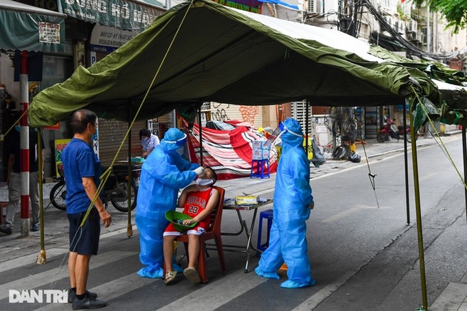 Vietnam records 7,594 more Covid-19 infections on Thursday - 1