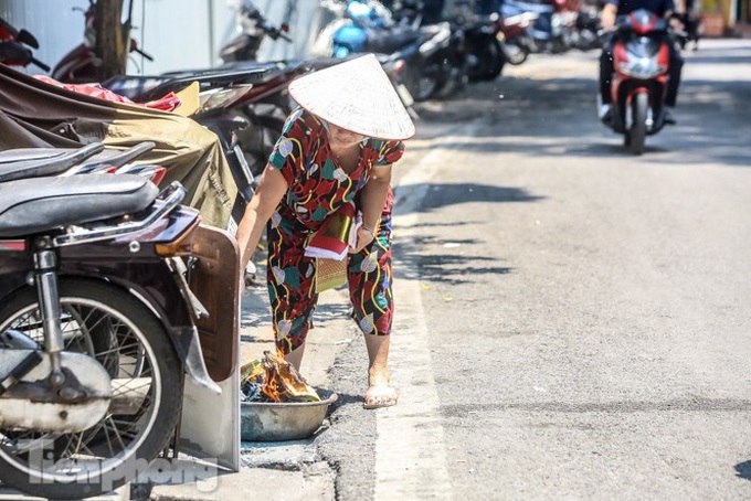 Votive paper burn on Hanoi's streets on Ghost Festival - 2