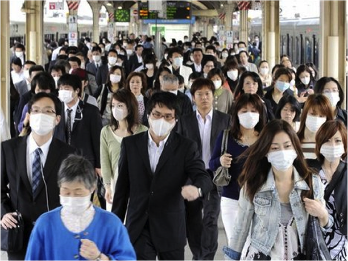 Japan eases mask guidelines, but few are keen to change - 1