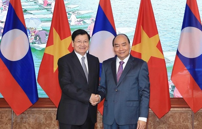Lao PM visits Vietnam, co-chairs inter-governmental committee’s session - 1