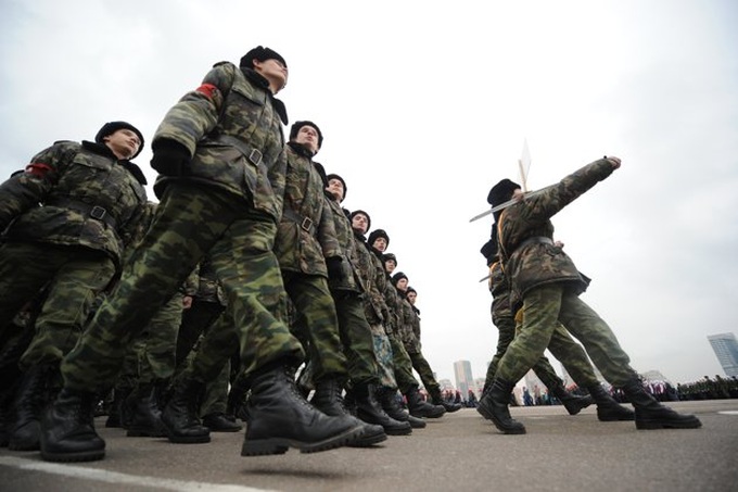 Putin vows to boost Russian army ahead of vote - 1