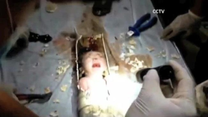 Newborn pulled alive from sewage pipe in block of flats - 1