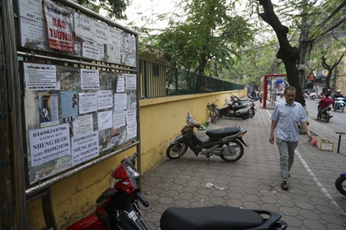 Public advertising boards in Hanoi misused - 10