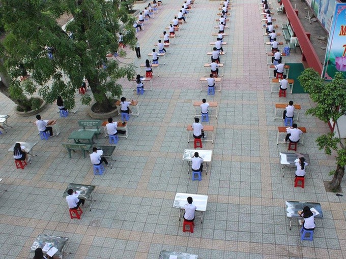 Students take exam in playground in HCM City - 1