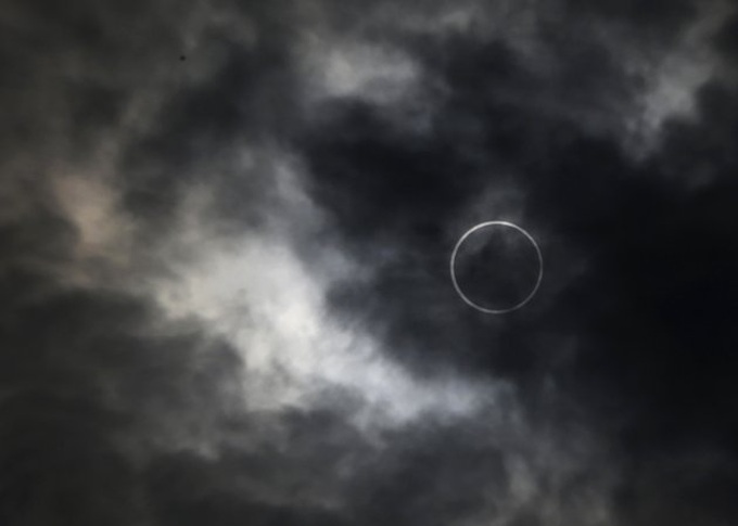 Millions look skyward as rare eclipse crosses Asia - 1