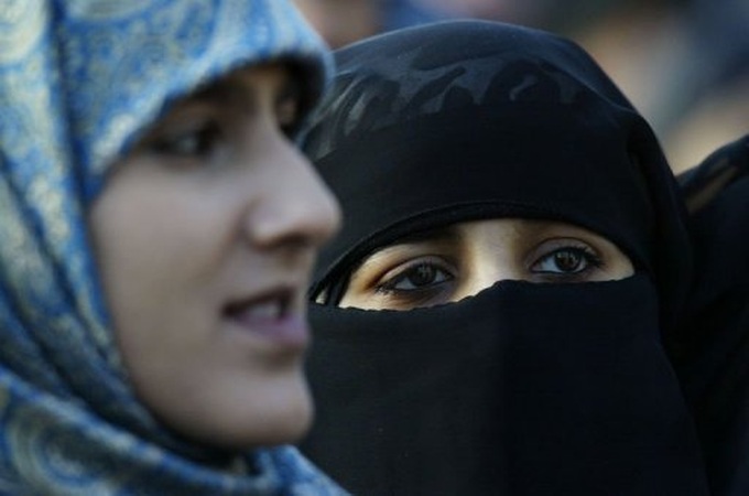British college drops Muslim veil ban amid outcry - 1 British college drops Muslim veil ban amid outcry - 1