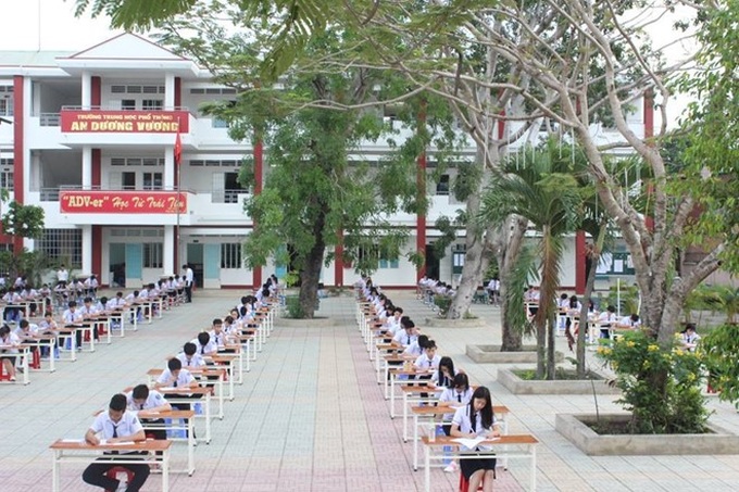 Students take exam in playground in HCM City - 2