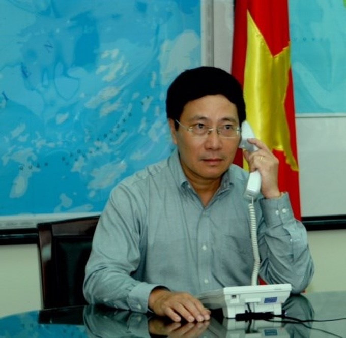 FM Minh holds phone talks with foreign counterparts - 1