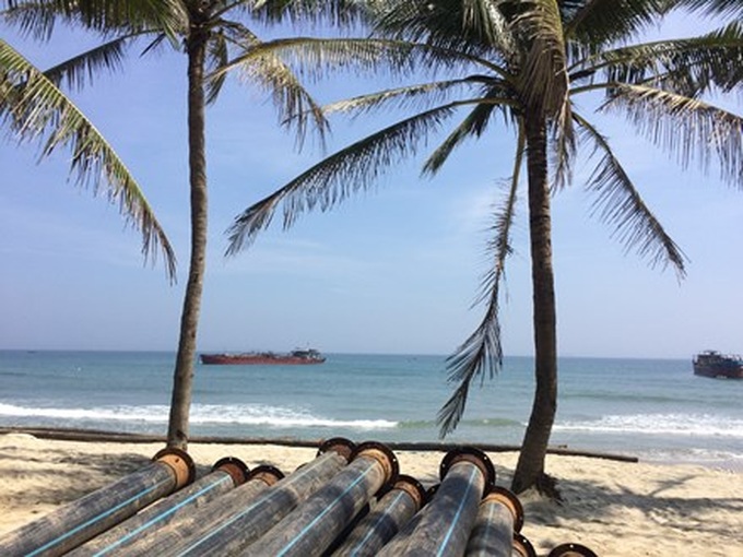 Illegal sand exploitation worsens erosion at Cua Dai Beach - 1