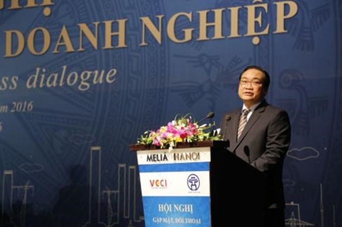 Hanoi vows to take lead in improving business climate - 1
