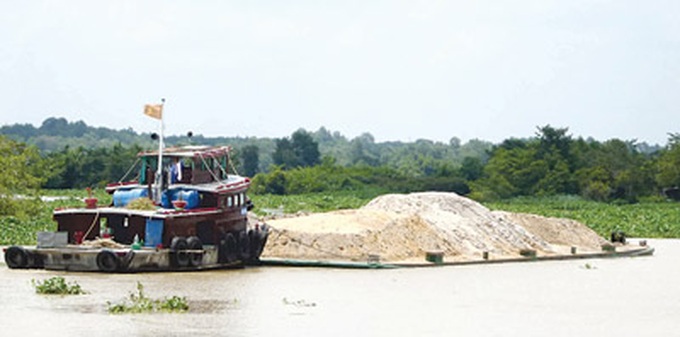 Illegal sand mining erodes riverbanks - 1