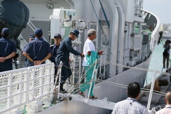 Japan police to hand pro-China group to immigration - 1