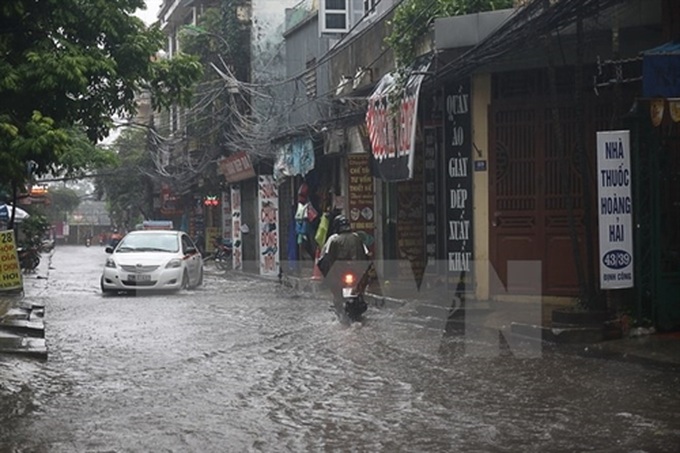 Measures announced to reduce flooding in Hanoi - 1