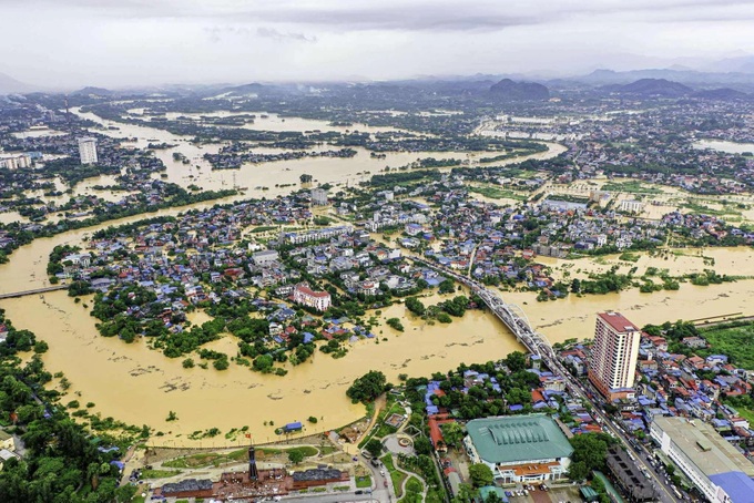 Thousands evacuated as Storm Matmo triggers record floods in Thai Nguyen - 1