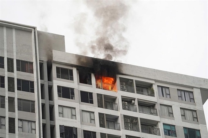 HCM City tightens enforcement over blocked apartment fire exits - 1