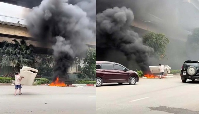 Hanoi man fined for burning waste under Thang Long Bridge - 1