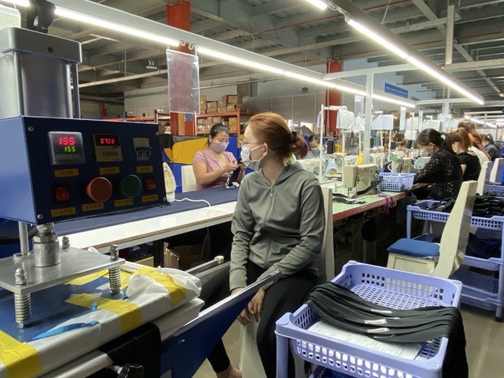 Chinese employees return to work in HCM City - 1