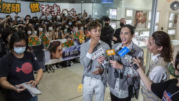 Hong Kong boy band ends show after falling screen hits dancers - 1