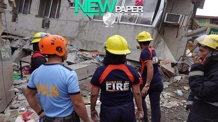 Philippines hunts for survivors after quake levels trade building - 1