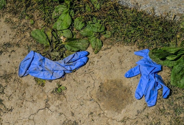 India battles black market in used gloves and masks - 1