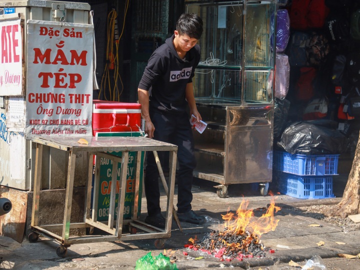 Votive paper burnt on Hanoi streets on Kitchen Gods’ Day - 2