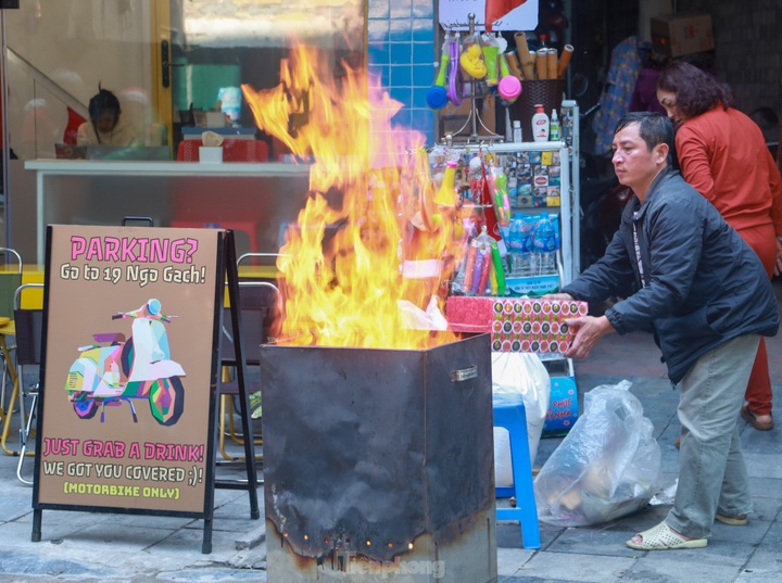 Votive paper burnt on Hanoi streets on Kitchen Gods’ Day - 1