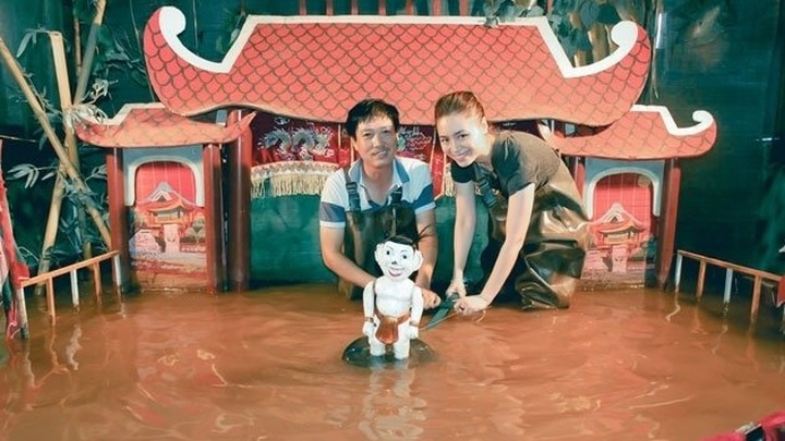 Young businesswoman promotes water puppetry art to the South - 1