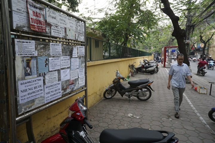 Public advertising boards in Hanoi misused - 10