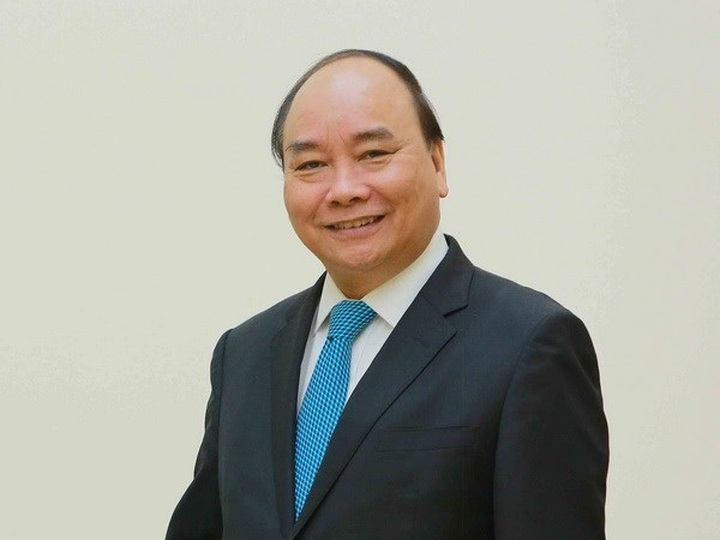PM Nguyen Xuan Phuc leaves for China’s first international import expo - 1