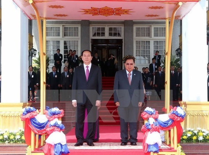 President Tran Dai Quang starts State visit to Laos - 1