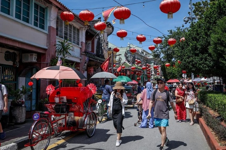 Người Trung Quốc sang Malaysia định cư tránh áp lực cuộc sống - 1