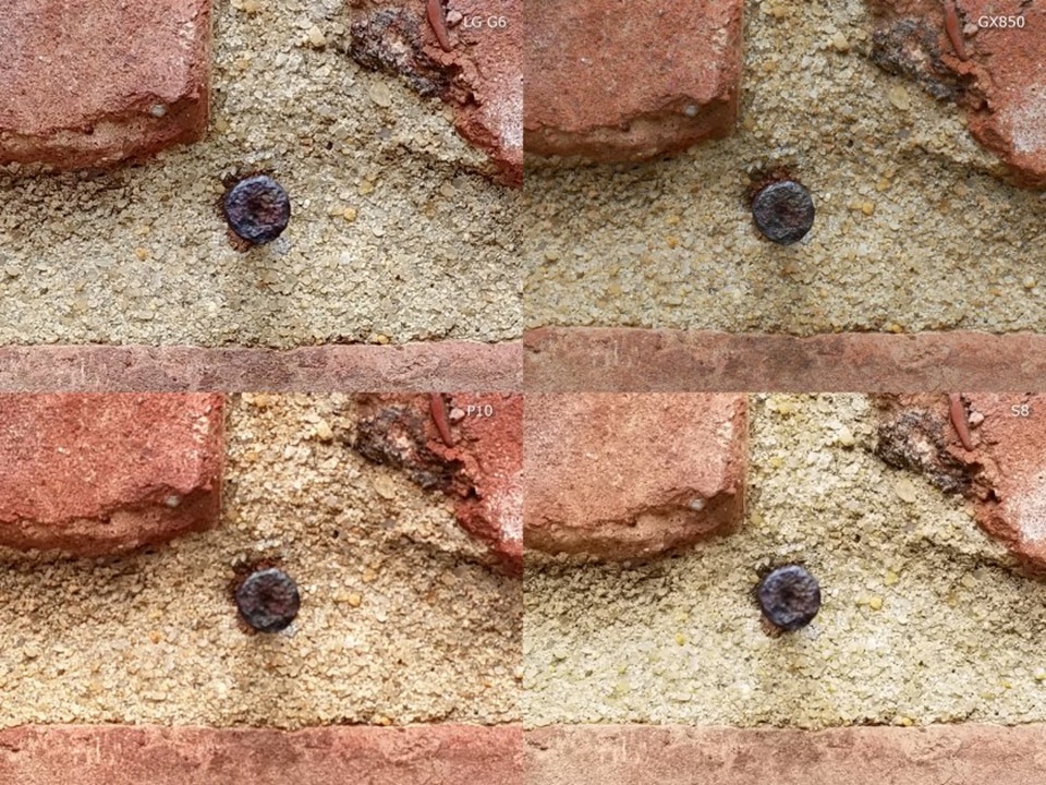 Khi chụp bắt nét vào chiếc đinh gắn trên bức tường, GX850, G6, và P10 mang đến độ sáng trung tính, trong khi Galaxy S8 có đôi chút dư sáng (overexposure). Về mức độ chi tiết, ảnh chụp trên LG G6  cho thấy độ nét quá cao tới mức thiếu thực tế, còn ảnh trên P10 thì có phần mềm mại hơn cả.