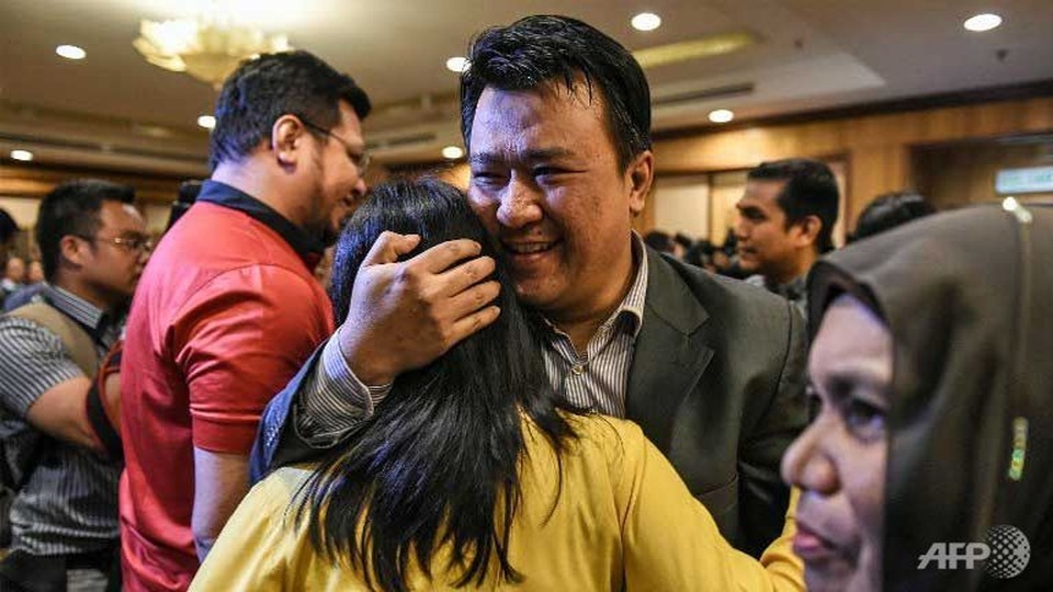 
9 công dân Malaysia trở về nước an toàn. (Ảnh: AFP)
